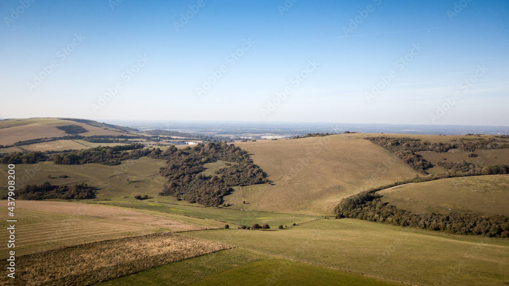 The South Downs, East Sussex, England. Elevated aerial rural view of the rolling hills of the south of England near Eastbourne.