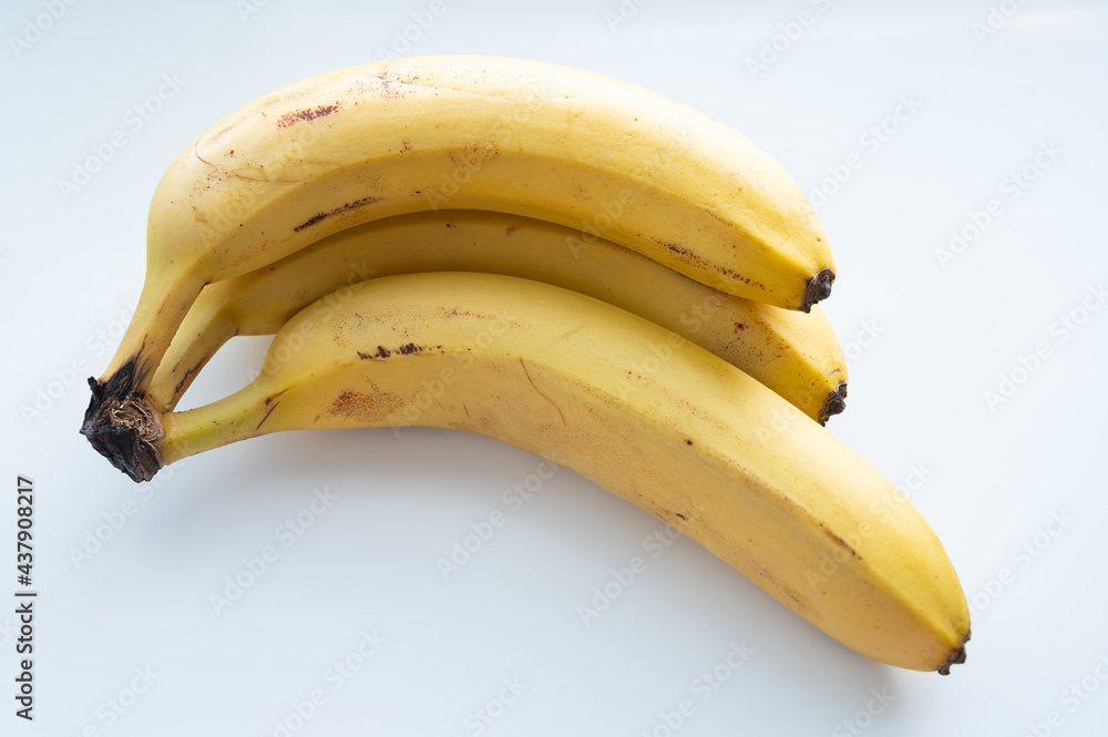 Ripe looking banana on white background. Selective focus. Ripe looking banana on white background. Selective focus.