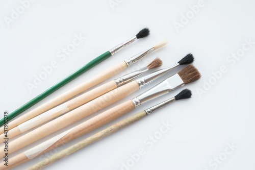 New and not used paint brushes on white background.