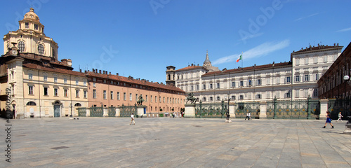 gate of the Royal Palace, statues of the Dioscuri, church and dome of San Lorenzo and Palazzo Reale in Piazza Castello.