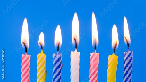 Collection set of birthday candles on blue background, making a wish