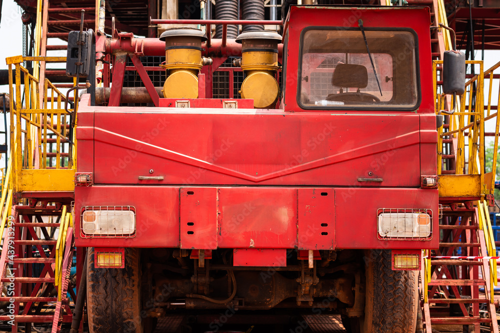 Semi-truck or mount-truck drilling rig platform, operating in onshore petroleum exploration activity. Heavy industrial equipment photo.