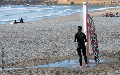 surfer in the beach shower