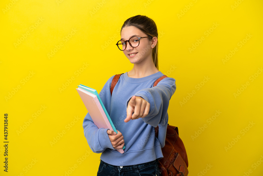 Student kid woman over isolated yellow background pointing front with happy expression Student kid woman over isolated yellow background pointing front with happy expression
