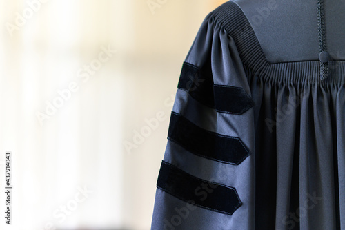 Принти на полотні PhD graduate in black graduatio gown University degree