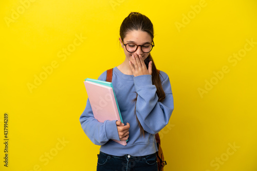 Student kid woman over isolated yellow background happy and smiling covering mouth with hand