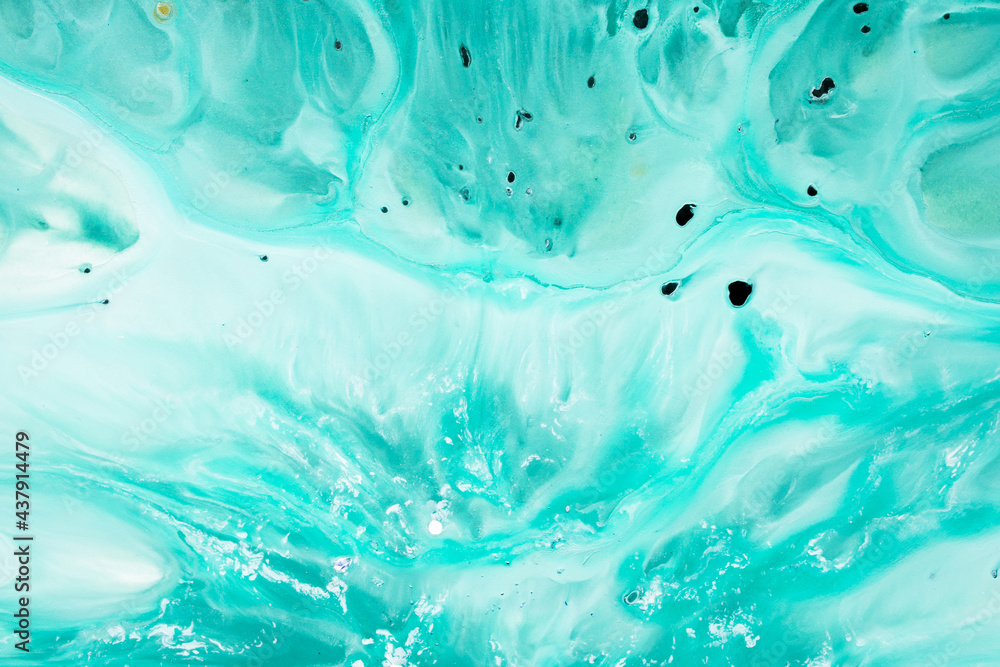 Abstract fluid acrylic painting. Marbled blue abstract background. Hand painted background with mixed liquid blue and green paints. Liquid marble pattern. Modern art. 