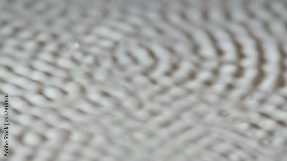 Cymatic patterns form on the white surface of the milk. The art of creating textures using milky liquid and acoustic frequencies of sound. Slow motion. Close up. Cymatic patterns form on the white surface of the milk. The art of creating textures using milky liquid and acoustic frequencies of sound. Slow motion. Close up.