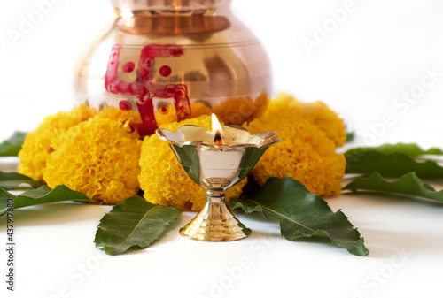 kalash pujan Indian festival akshaya tritiya Decorative kalash with coconut and leaf with floral decoration photo