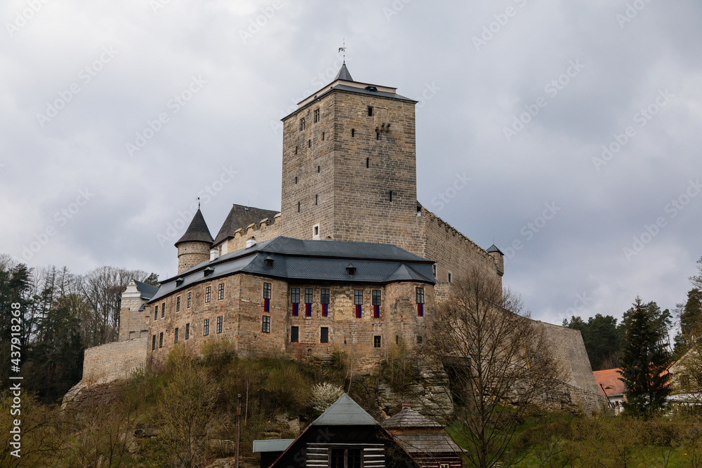 Medieval gothic castle Kost or Bone with tower in spring day, ancient fortresses on hill, fairytale stronghold, landmark in countryside, Bohemian Paradise or Cesky Raj, Czech Republic
