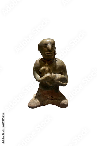 Ancient green glazed woman doll that holding a baby, isolated on white background.