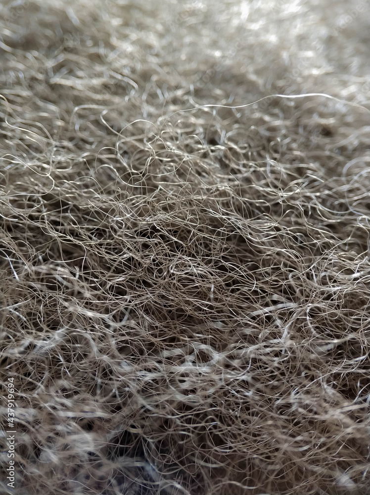 Close-up gray fibers of artificial filler. Synthetic soft wool Close-up gray fibers of artificial filler. Synthetic soft wool