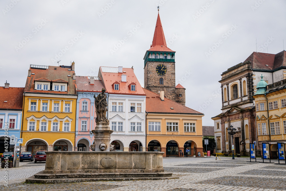 Wallenstein square with renaissance historical buildings, baroque church of St. James the Greater, gothic tower Valdice gate, Fountain with statue of Amphithrite, Jicin, Czech Republic