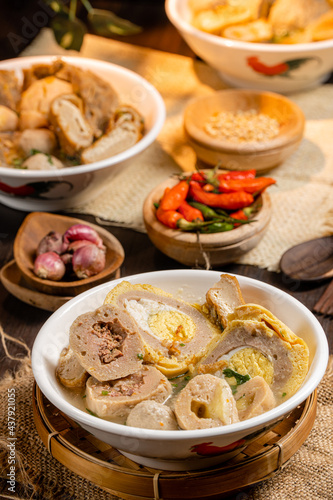 Bakso or baso is an Indonesian meatball  Its texture is similar to the Chinese beef ball  fish ball  or pork ball. The word bakso refer the complete dish of beef broth soup  noodle  tofu and bok choy.