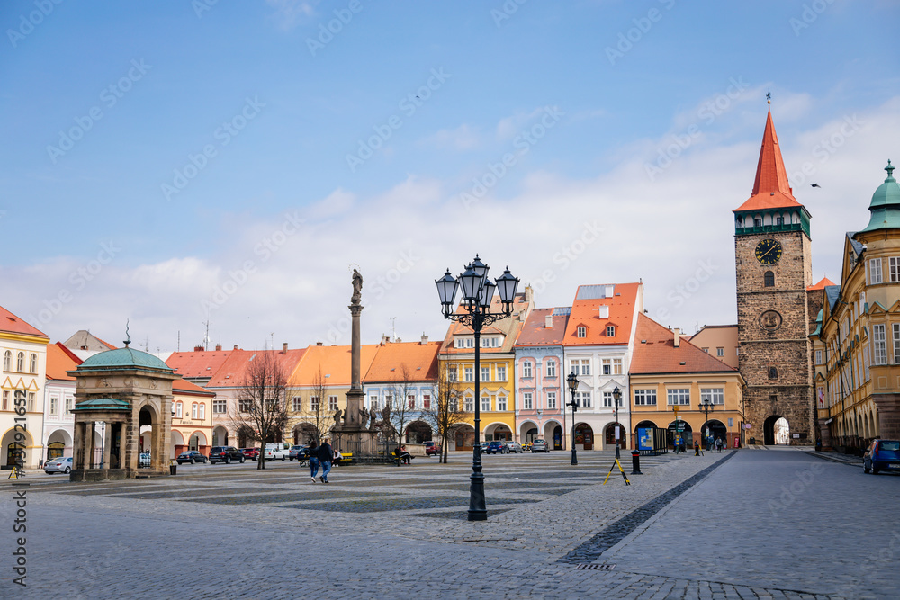 Fototapeta premium Wallenstein square, renaissance historical buildings, baroque meteorological column, gothic tower Valdice gate and Marian Column, sculptural group of Virgin Mary, Jicin, Czech Republic