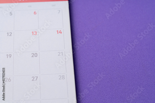 close up of calendar on the purple table background, planning for business meeting or travel planning concept