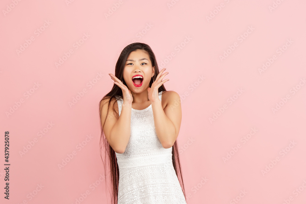 Wow. Beautiful female half-length portrait isolated on studio backgroud. Young emotional surprised woman standing with open mouth. Wow. Beautiful female half-length portrait isolated on studio backgroud. Young emotional surprised woman standing with open mouth.