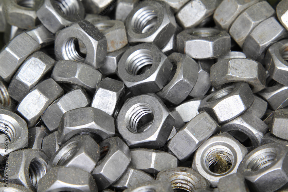 Lots of steel nuts close-up texture background. Lots of steel nuts close-up texture background.