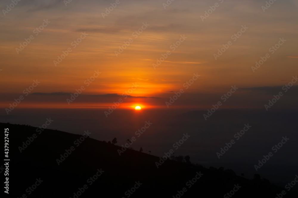 Golden sunrise at Mangli Sky View on the slopes of Mount Sumbing, Magelang, Central Java, Indonesia