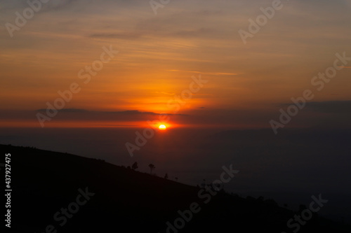 Golden sunrise at Mangli Sky View on the slopes of Mount Sumbing, Magelang, Central Java, Indonesia