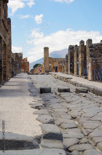 Famous landmark of ancient and historic city temple ruins with columns and walls on archeologic site museum Pompeji Pompeii excavation site in Italy near Naples and Vesuv Volcano photo