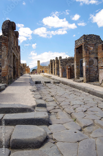 Famous landmark of ancient and historic city temple ruins with columns and walls on archeologic site museum Pompeji Pompeii excavation site in Italy near Naples and Vesuv Volcano photo