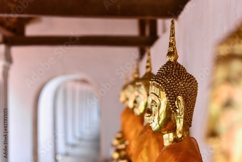 Golden Buddha Sculptures at Wat Khanon Nang Yai in Ratchaburi Province, Central Thailand photo