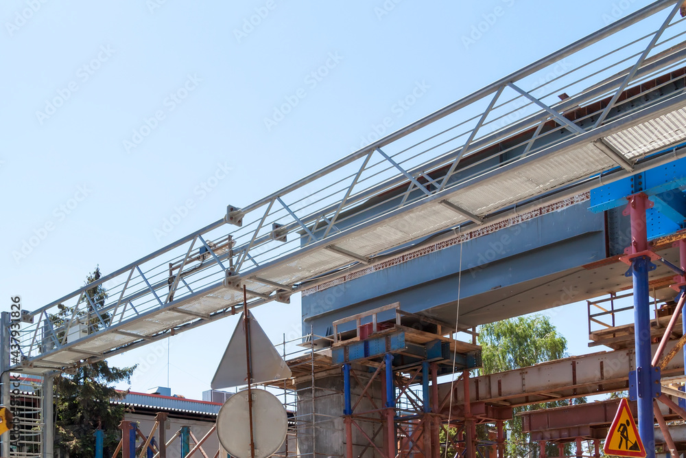 close-up view of road bridge under construction. connection of steel powerful straight crossbar, bridge connection, metal architecture