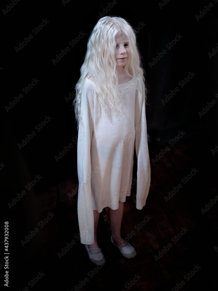 Beautiful  albino girl on black background