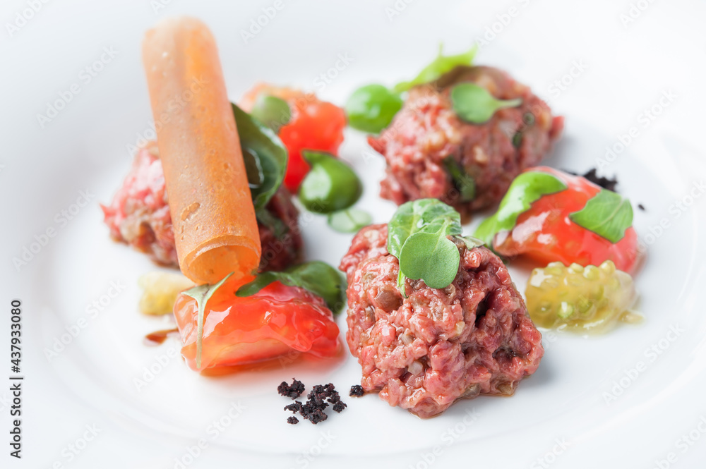 Appetizer on a plate of fresh tomatoes Appetizer on a plate of fresh tomatoes