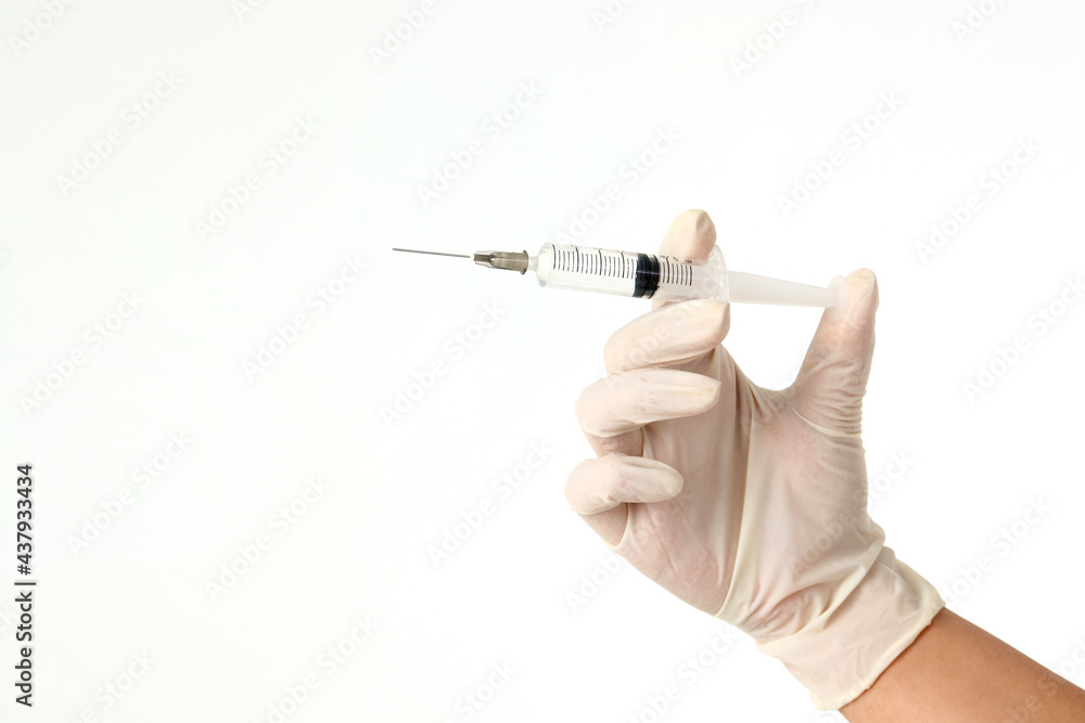 doctor wearing gloves Hold the vaccination needle. concept of medical services in hospitals Prevent viruses and germs Treatment and health care of patients. white background doctor wearing gloves Hold the vaccination needle. concept of medical services in hospitals Prevent viruses and germs Treatment and health care of patients. white background
