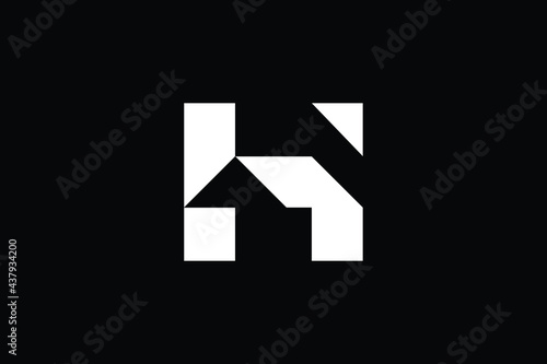 Logo design of H in vector for construction  home  real estate  building  property. creative elegant Monogram. Premium Business home logo icon. White color on black background.