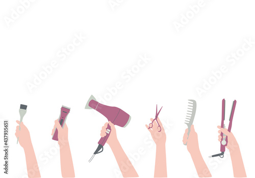 Hands with a hairdressers tool, hair dryer, comb. Background with hair salon accessories with space for text. Frame, border for beauty information