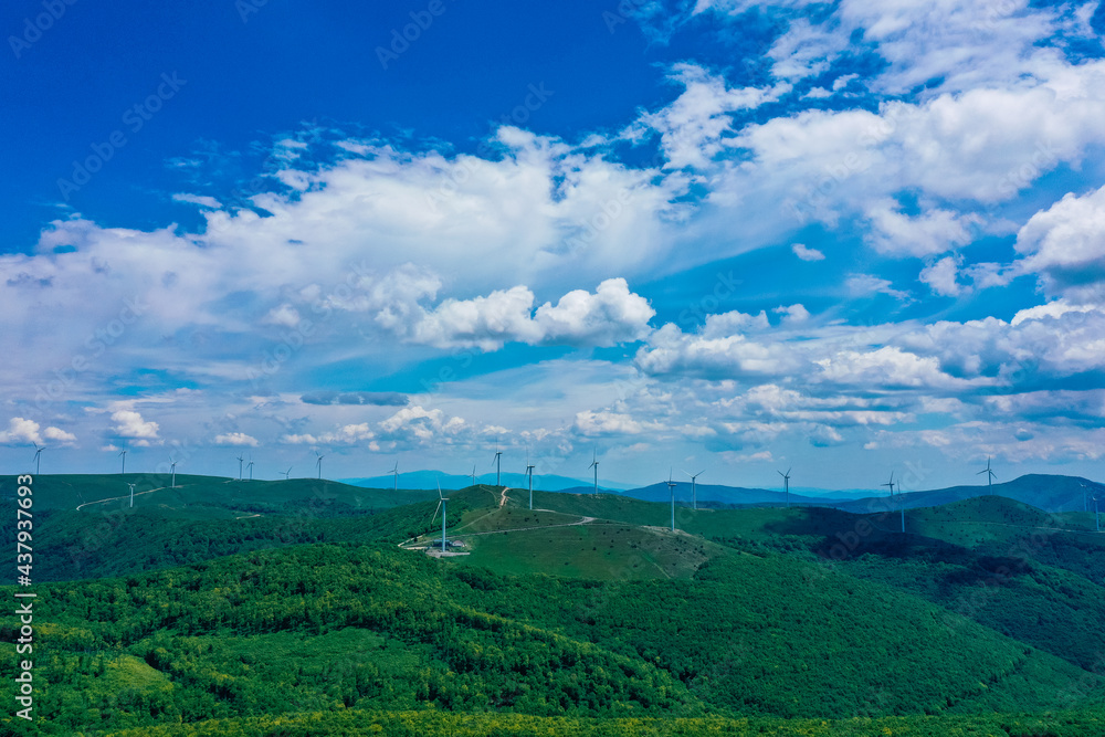 Wind turbine towers, energy saving concept. Alternative electricity supply industry, windmill turbine stations. Landscape of the mountains. Wind turbine towers, energy saving concept. Alternative electricity supply industry, windmill turbine stations. Landscape of the mountains.