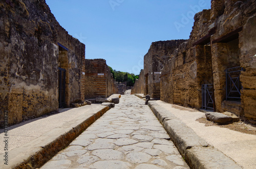 Famous landmark of ancient and historic city temple ruins with columns and walls on archeologic site museum Pompeji Pompeii excavation site in Italy near Naples and Vesuv Volcano photo