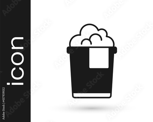 Black Bucket with foam and bubbles icon isolated on white background. Cleaning service concept. Vector