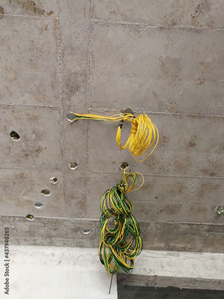 Electrical wires coming out of a concrete ceiling Stock Photo Adobe Stock