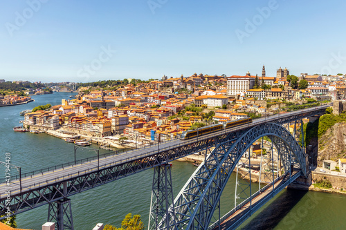 Beautiful panorama of Porto with famous bridge in the foreground, Portugal © eunikas