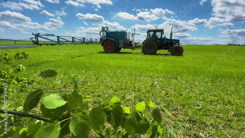 tractor sprays fertilizer on the field. High quality 4k footage