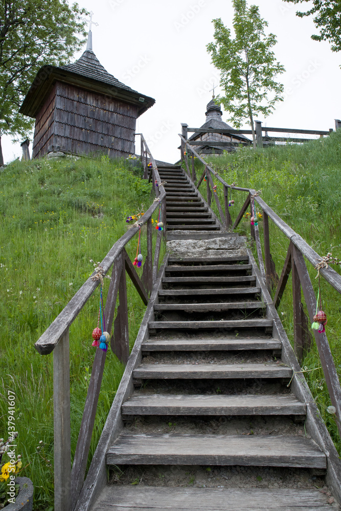 Very long and steep wooden staircase to the old wooden church Very long and steep wooden staircase to the old wooden church