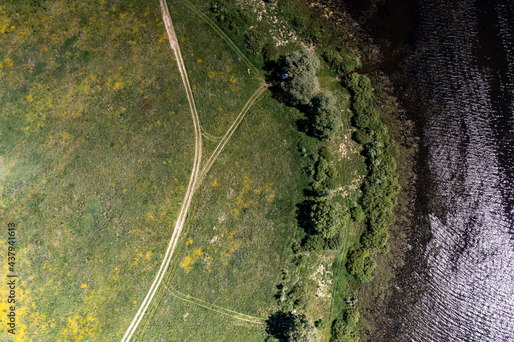 panoramic view from the drone to the village of a large lake and forest and fields and roads panoramic view from the drone to the village of a large lake and forest and fields and roads
