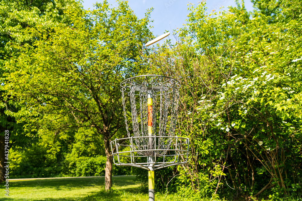 Disc golf is a flying disc sport in which players throw a disc at a