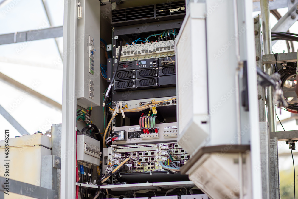 close up electrical control cabinet, signal circuit, mobile network The bottom of the mobile network tower was opened to fix and upgrade the system to 5G network. close up electrical control cabinet, signal circuit, mobile network The bottom of the mobile network tower was opened to fix and upgrade the system to 5G network.
