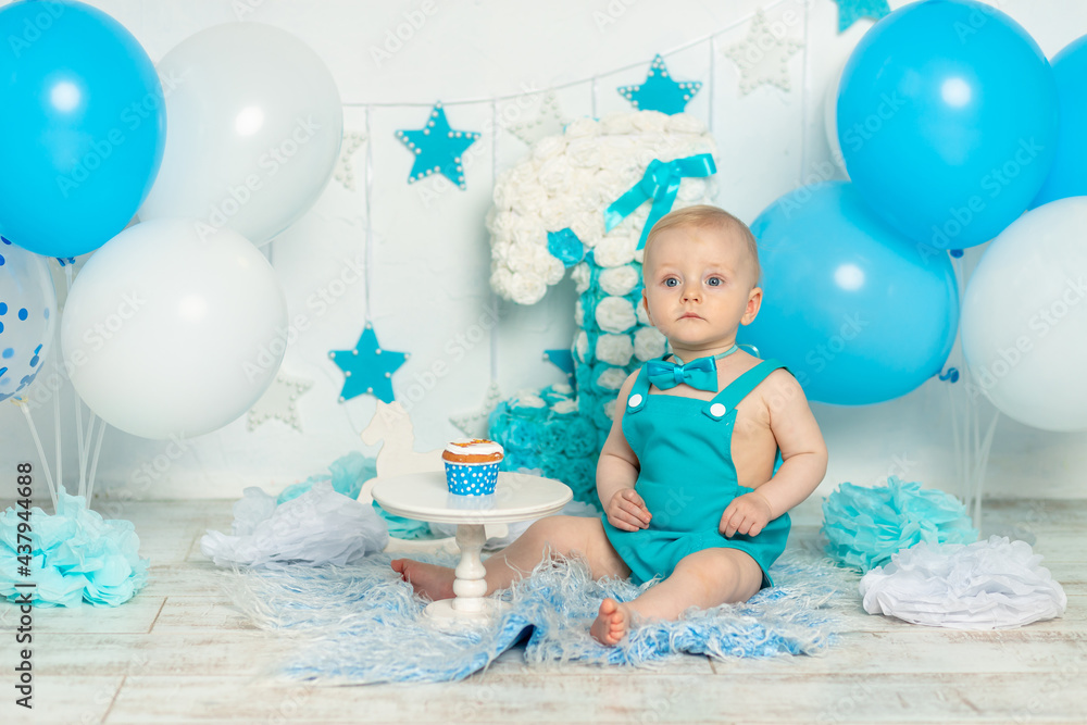 birthday party one year old boy in blue with balloons and cake, holiday and decor concept, baby with cake birthday party one year old boy in blue with balloons and cake, holiday and decor concept, baby with cake