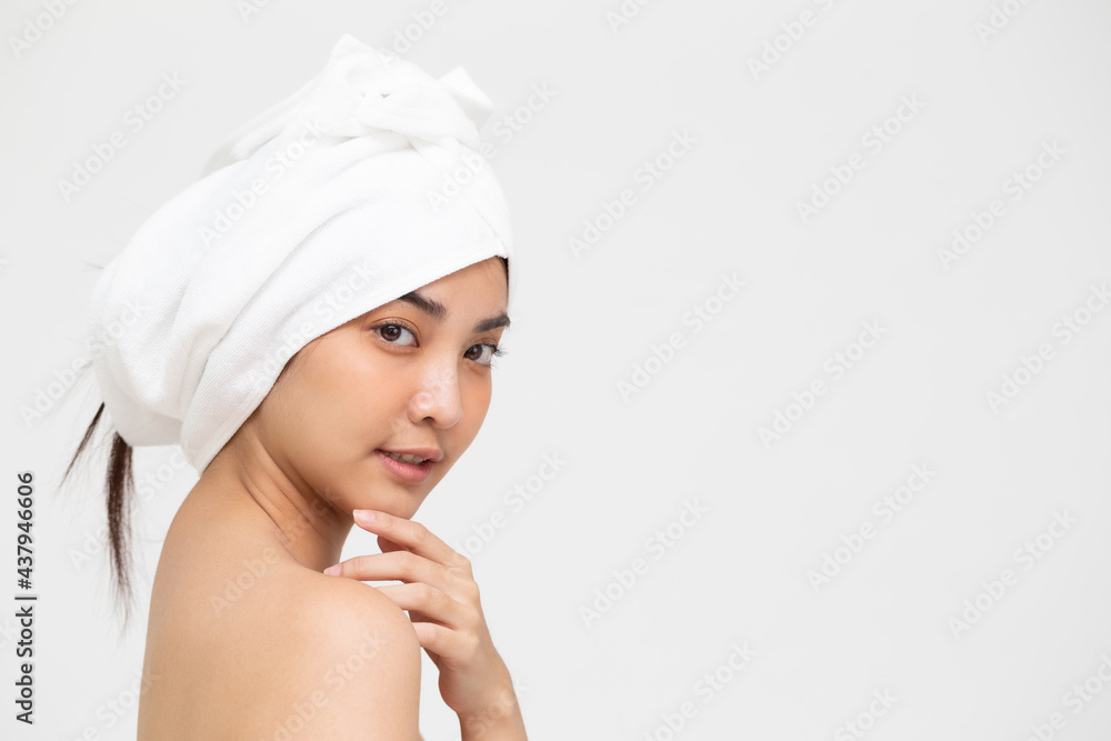 Beautiful Asian woman wearing hair white towel on a head isolated on white background, Spa skin care and beauty treatment concept Beautiful Asian woman wearing hair white towel on a head isolated on white background, Spa skin care and beauty treatment concept