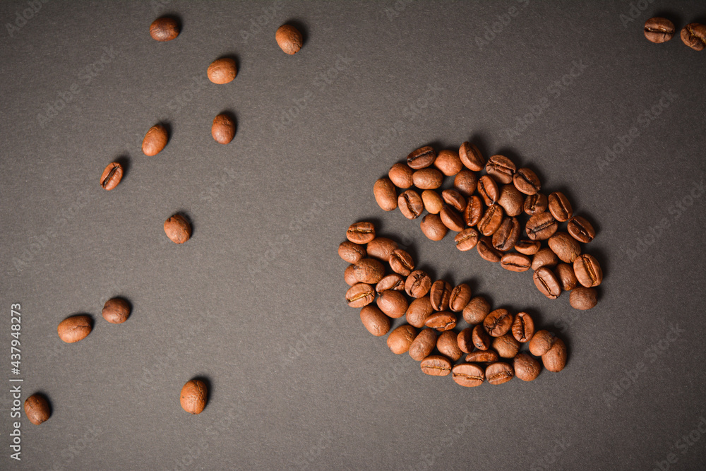 Horizontal background image of Coffee bean shape isolated on dark background. Coffee seed silhouette with scattered roasted high quality coffee beans on background. Aroma drink
Horizontal background image of Coffee bean shape isolated on dark background. Coffee seed silhouette with scattered roasted high quality coffee beans on background. Aroma drink