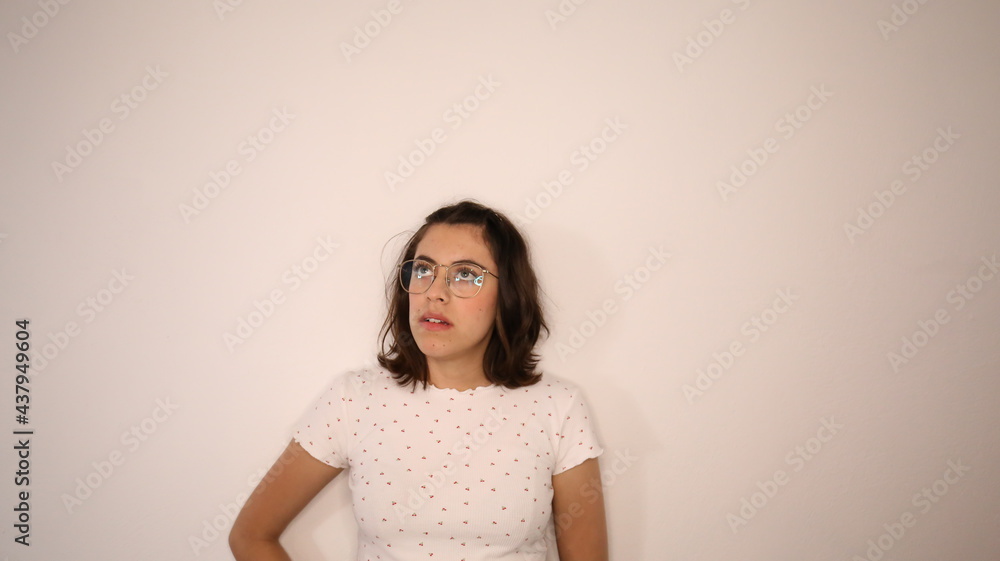 young woman thoughtful thinking isolated on white back ground in studio. young woman thoughtful thinking isolated on white back ground in studio.