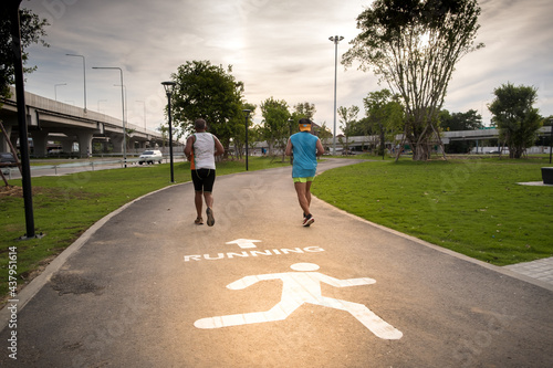 Canvas Print People running on street in garden park for exercise and build immunity for protect covid-19 in Bangkok, Thailand