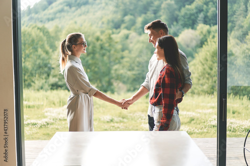 Successful real estate agent making a deal and shakes hands 