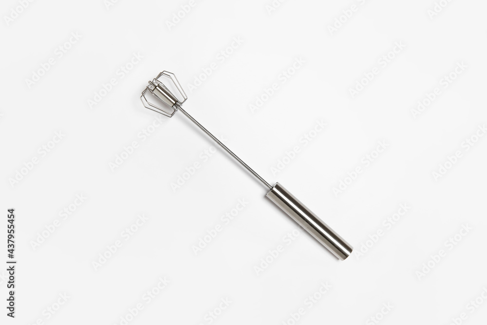 Whisk Hand Push Mixer for Cooking Egg Beater isolated on white background. High-resolution photo.